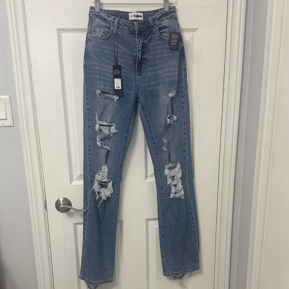 14. Fashion Nova Ripped Blue Straight Leg Jeans